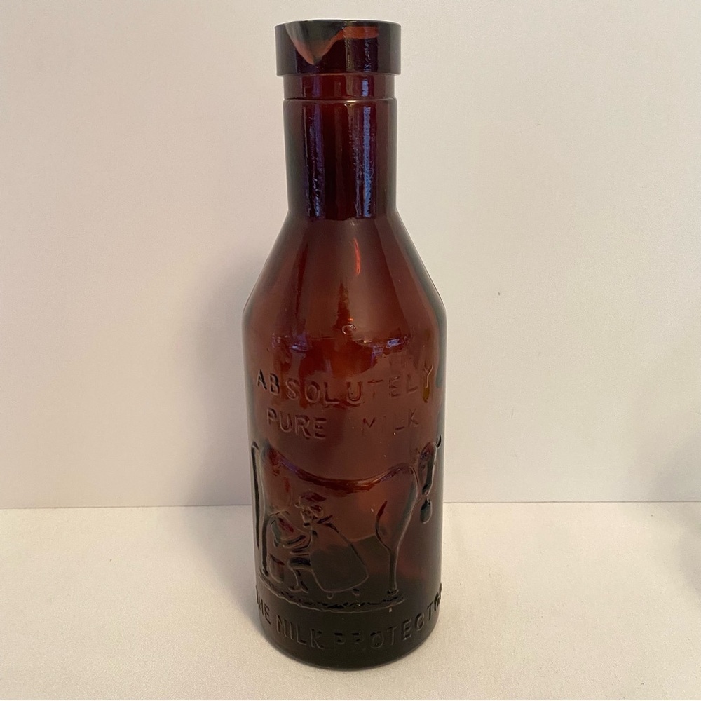 Absolutely Pure Milk The Milk Protector Purple Glass Milk Bottle Vintage